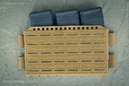 Molle pouch with three magazines on a gray background